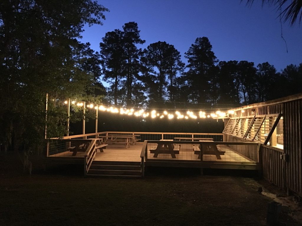 Slabs BBQ Restaurant #cookedonwood #brisket #ribs #pulled pork. Outside seating Deck  #romanticdining #lakefrontdining. Sit under the old oak trees. #Barbeque #lakesidedining #wooddeck #outsideseating #LakeCityBBQ #lakeCitySCdining #romanticdiningSC